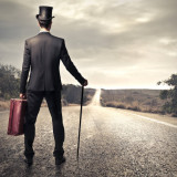 man-in-suit-walking-deserted-road-square-160x160